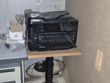 a toaster oven sitting on top of a table in a kitchen