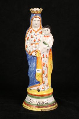 an image of a statue of a woman holding a child