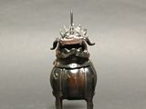 a statue of a dog with a crown on it ' s head