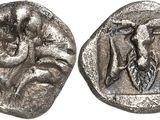 a close up of a silver coin with a bird on it