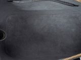 the inside of a black purse with a zipper on it