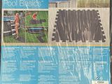 a close up of a plastic pool cover on a wooden deck