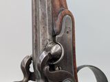 a close up of a gun on a white background