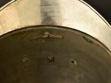 a close up of a metal pot with holes in it