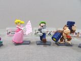 five figurines of different characters on a table