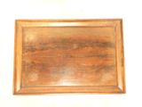 a picture of a wooden tray on a white surface
