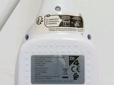 a close up of a white radio on a table