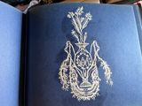 a blue book with a drawing of a rabbit on it
