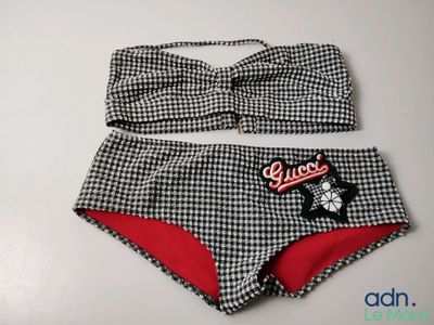 a close up of a bikini top and panties on a table