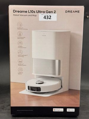 packaging of a white box containing a coffee machine on a wooden table