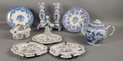 many different types of plates and bowls on the table