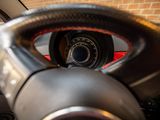 a close up of a steering wheel in a car
