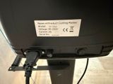 a close up of a black television on a stand
