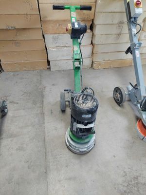 two machines that are sitting on the floor