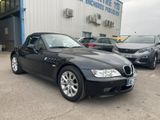 black bmw z4 convertible parked in front of a bmw dealership