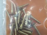 a bag of screws that are sitting on a table