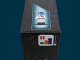 a box with a lego figure in it on a blue background