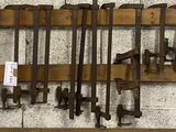 a lot of tools hanging on the wall in the garage