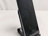 a cell phone that is sitting on a stand