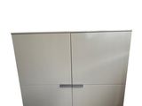 a close up of a stainless steel cabinet with two doors