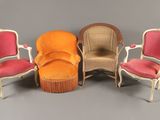 four chairs and a ottoman are arranged in a circle on a gray surface