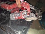a person using a cordless drill to remove a piece of plastic