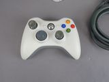 a game controller and a mouse on a table