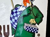 une affiche représentant un homme coiffé d'un haut-de-forme et tenant une canne