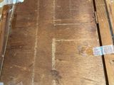 a piece of wood that has been stripped off and is sitting on the floor