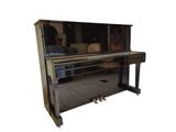 a piano with a mirror on top of it