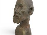 an image of a bronze bust of a man with a beard