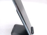 a cell phone that is sitting on top of a stand