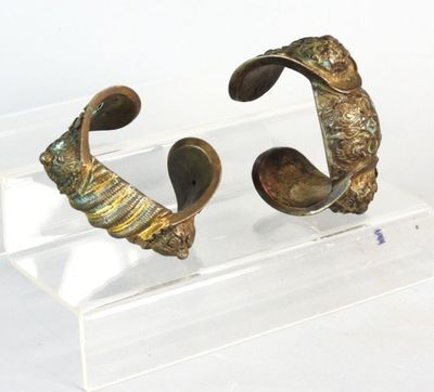 two pieces of art that are on a clear stand