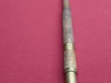 a cane that is sitting on a red cloth