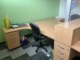 an image of a desk with a chair and a map on the wall