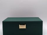 a green box with a gold handle on a white background