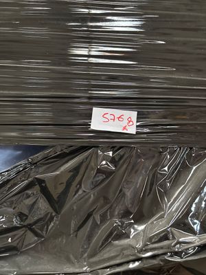 a pile of aluminum sheets sitting on top of each other