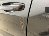 a close up of a car door with a sticker on it