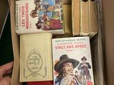 a box full of books that are sitting on a table