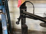 a hat that is sitting on a machine in a garage
