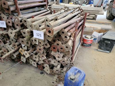 a large pile of pipes and pipes in a warehouse