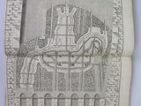 an old book with a drawing of a man on a horse