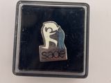 a close up of a pin with a horse on it