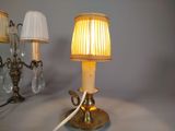 a lamp that is sitting on a table next to a lamp