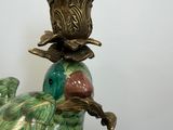 a bird that is sitting on top of a vase