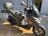 a scooter that is parked outside of a building