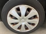 a tire that has been painted white and has a hole in the tire
