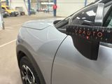 a close up of a car with a measuring tape on the side of it