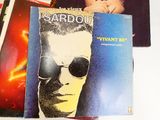 a picture of a man with sunglasses and a book