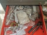 a drawer full of assorted items on a table